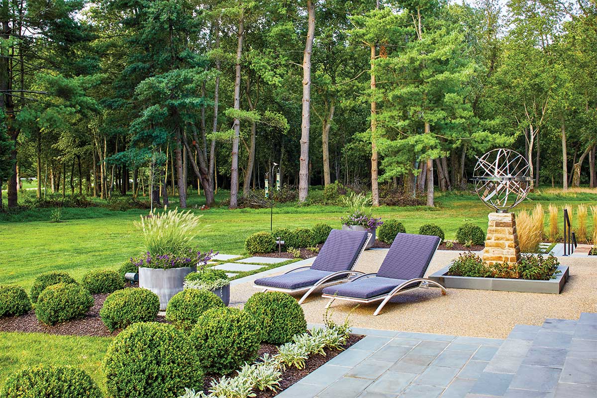 hardscaped patio with two lounger chairs