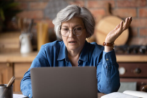 senior citizen at computer
