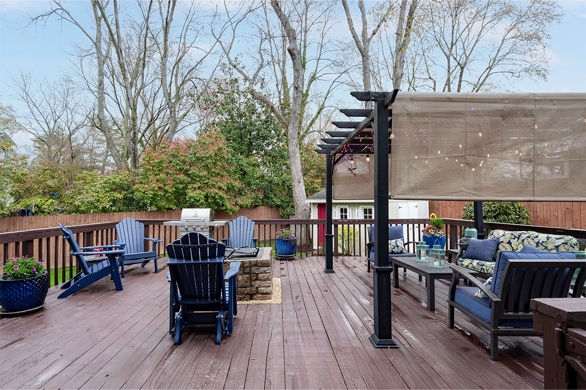 deck with firepit and sitting area