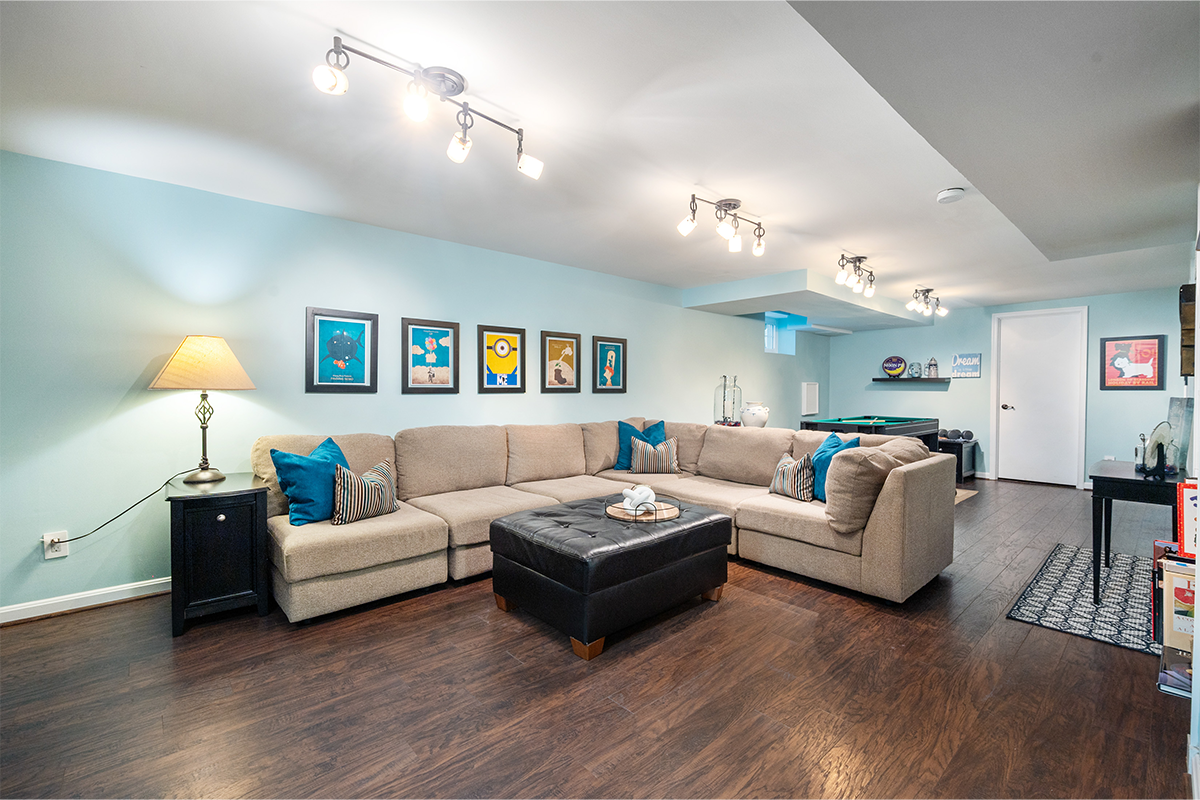 light blue rec room with sectional couch