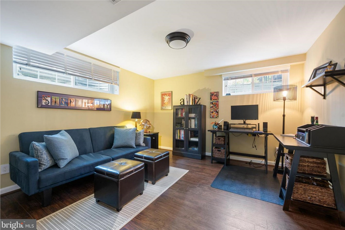 yellow den with couch and desk