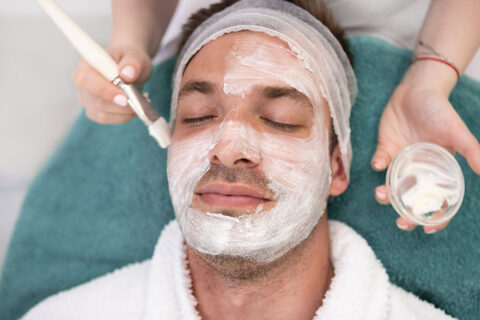 Man getting facial spa treatment