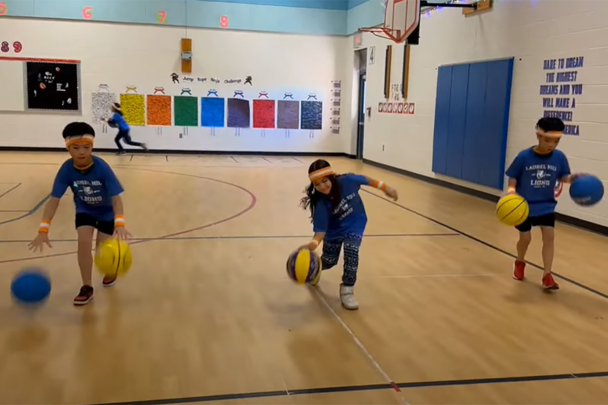 Laurel Hill students bouncing basketballs