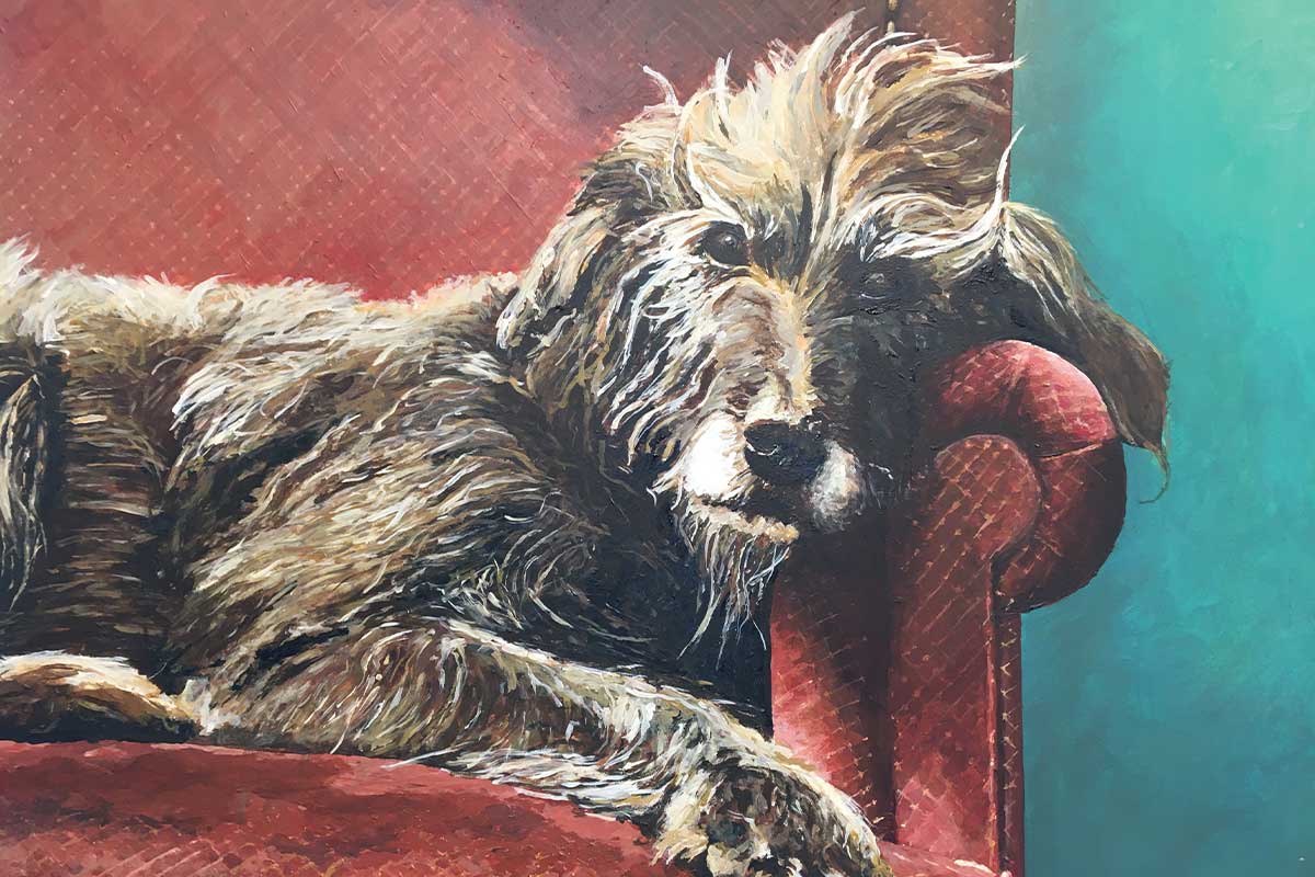 painting of dog laying on couch