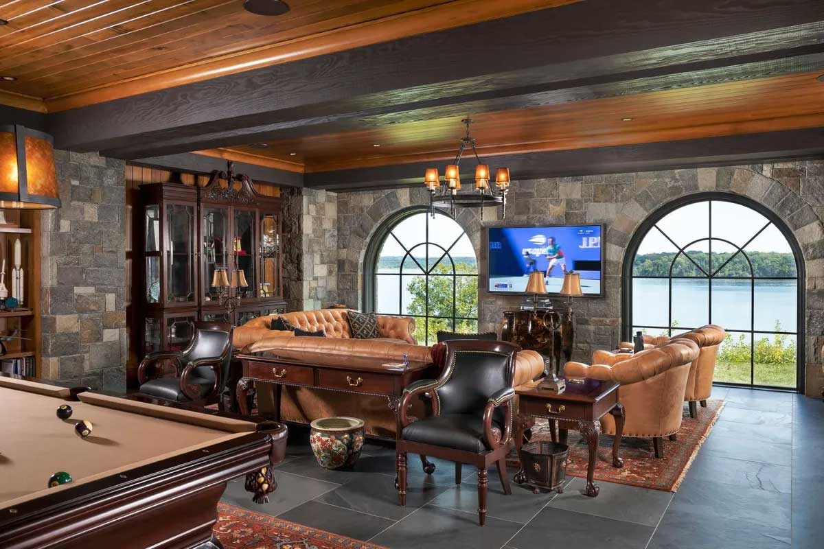 game room with pool table and stone walls