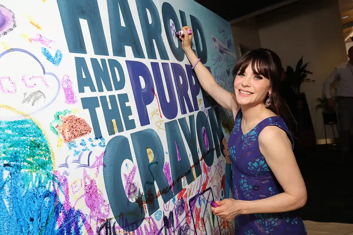 Zooey Deschanel signs Harold and the Purple Crayon sign