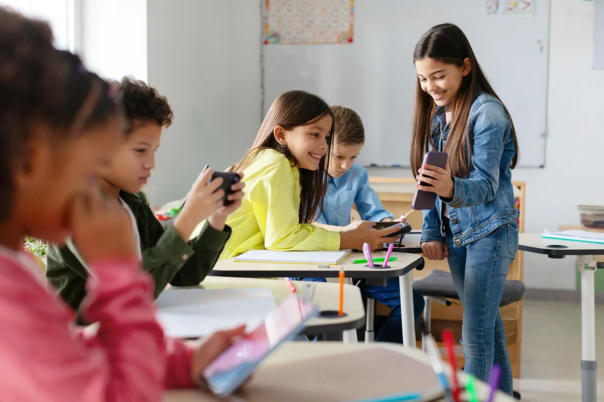 students with cellphones in classroom