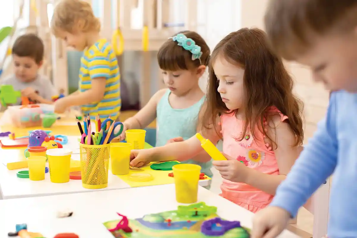 children playing with playdough at day care