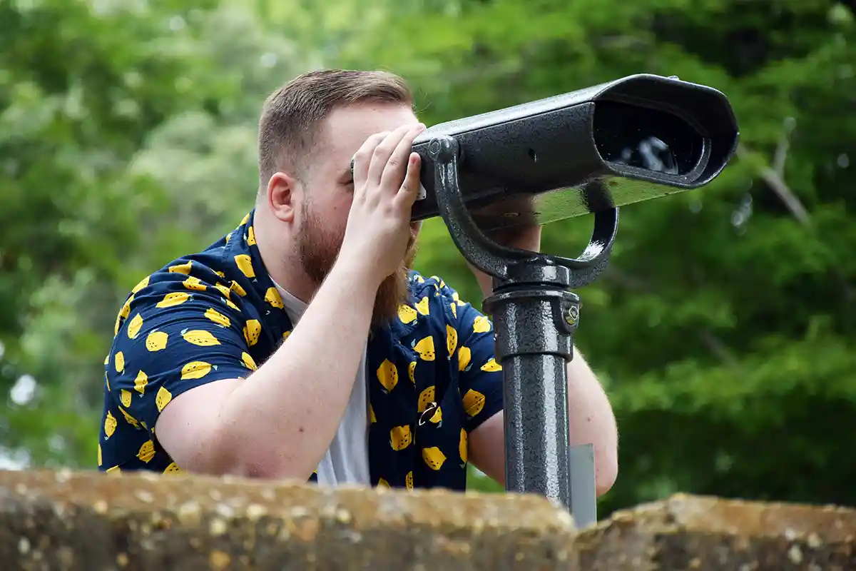 Robert Purinton looks through the viewfinder for the colorblind at Pocahontas State Park