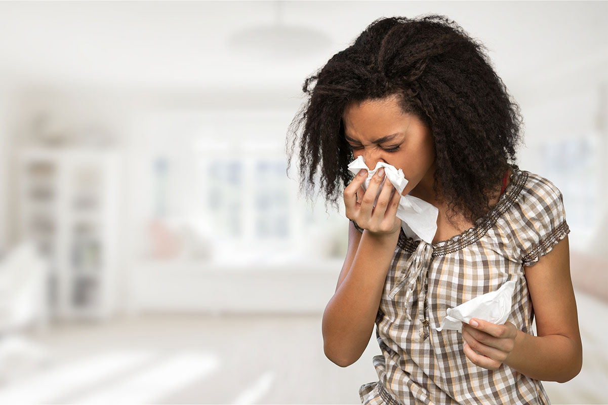 woman sneezing