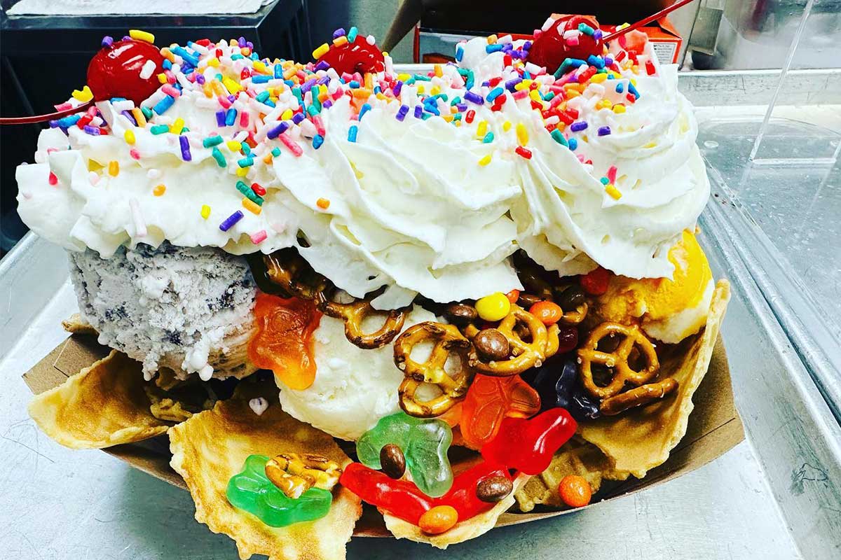 ice cream nachos with whipped cream, pretzels, and gummy bears