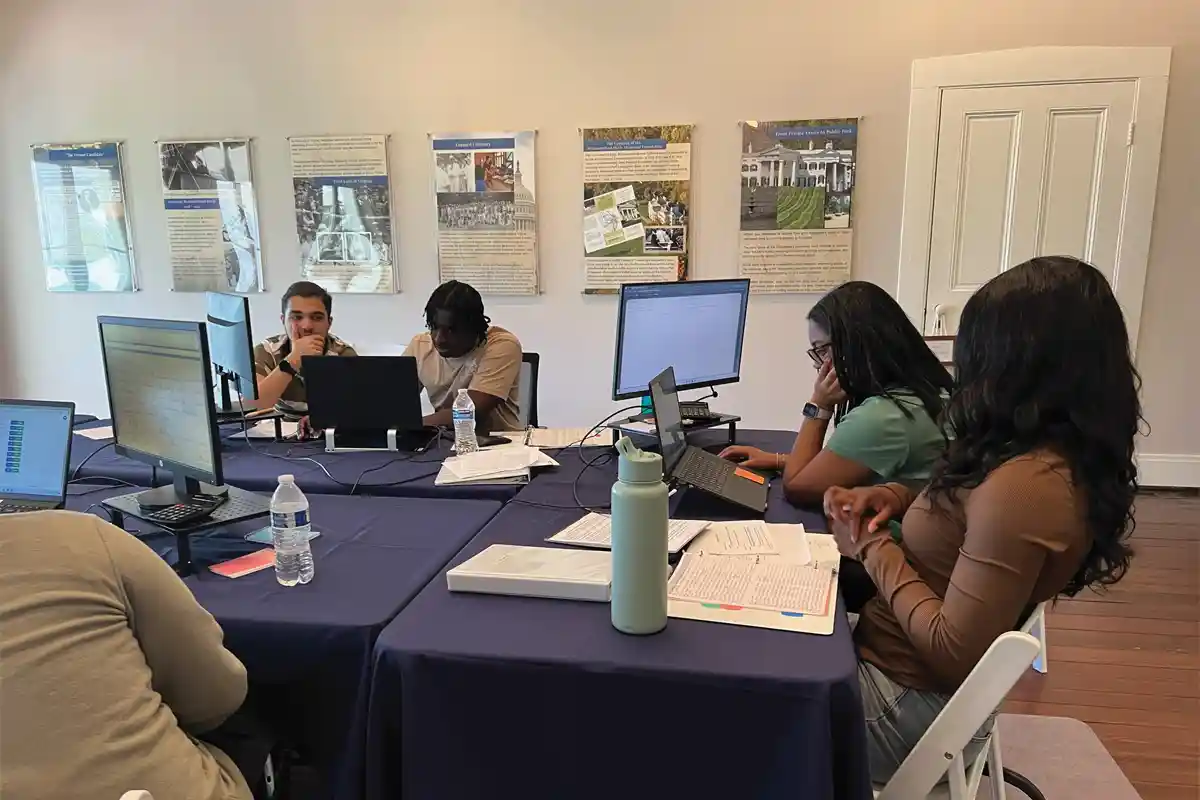 Student volunteers enter records for the 246 Years Project.