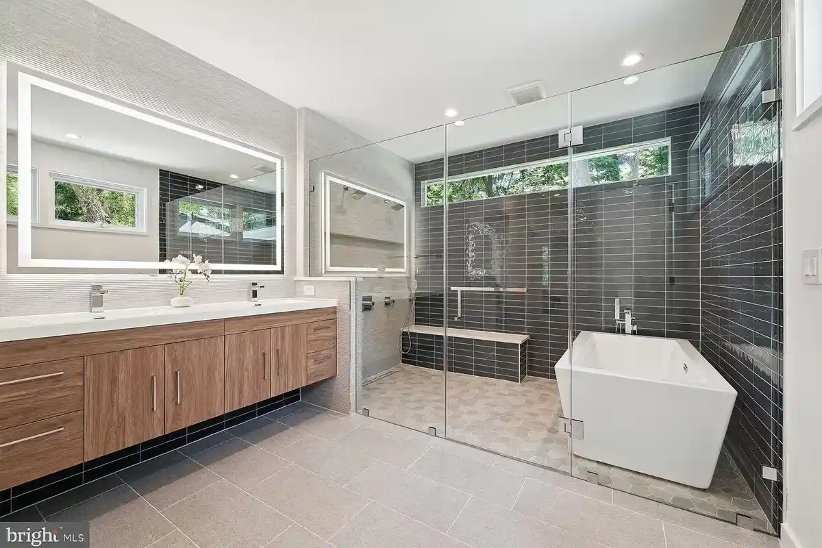 primary bathroom that includes a wet room with a soaking tub and shower at 7318 Rippon Rd.