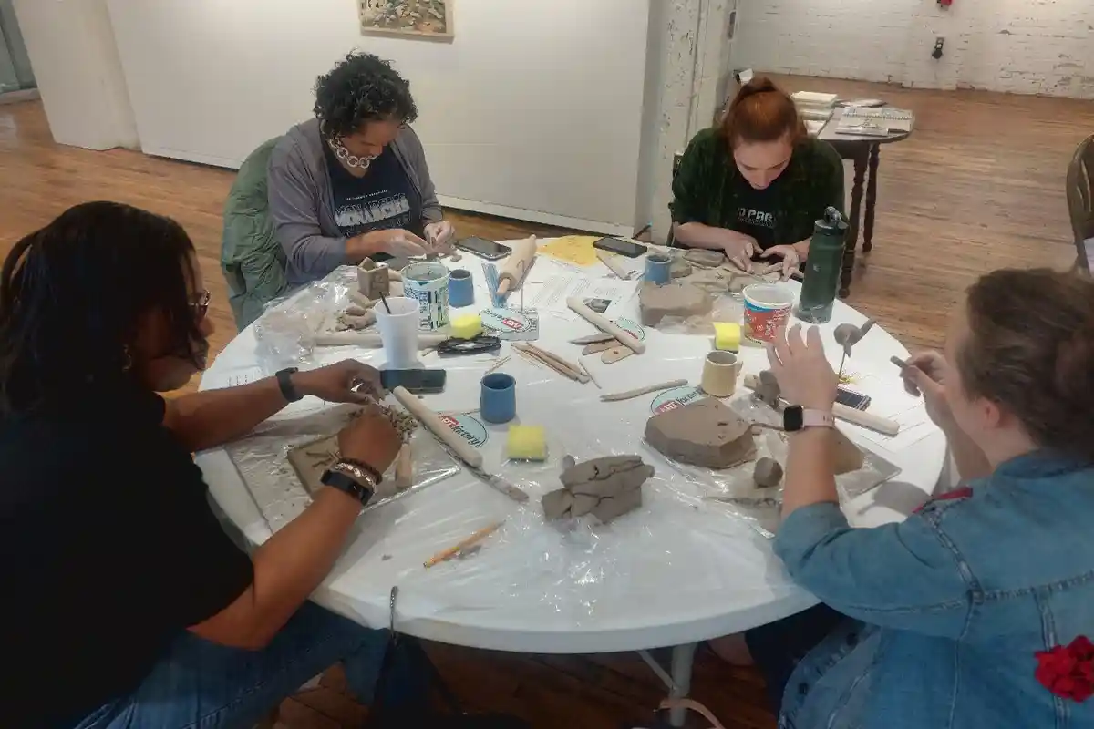 Students use clay in an Artful Wellness class at ARTfactory.
