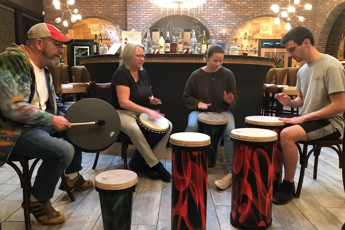Students drumming in Artful Wellness class at The ARTfactory.