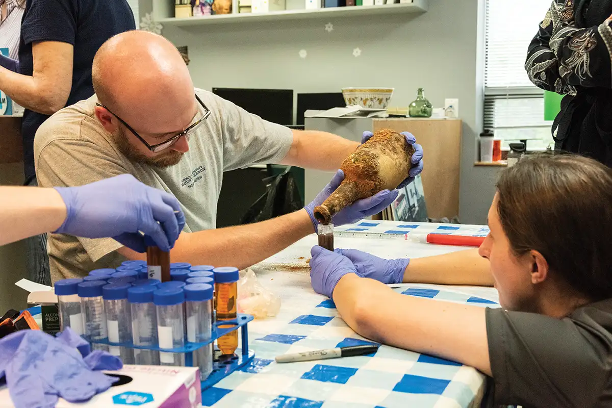 Researchers work on preserved bottle