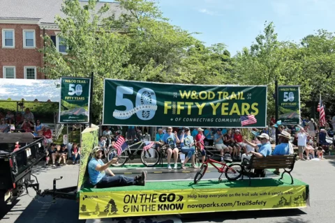 Parade float with banner announcing W&OD's 50th anniversary
