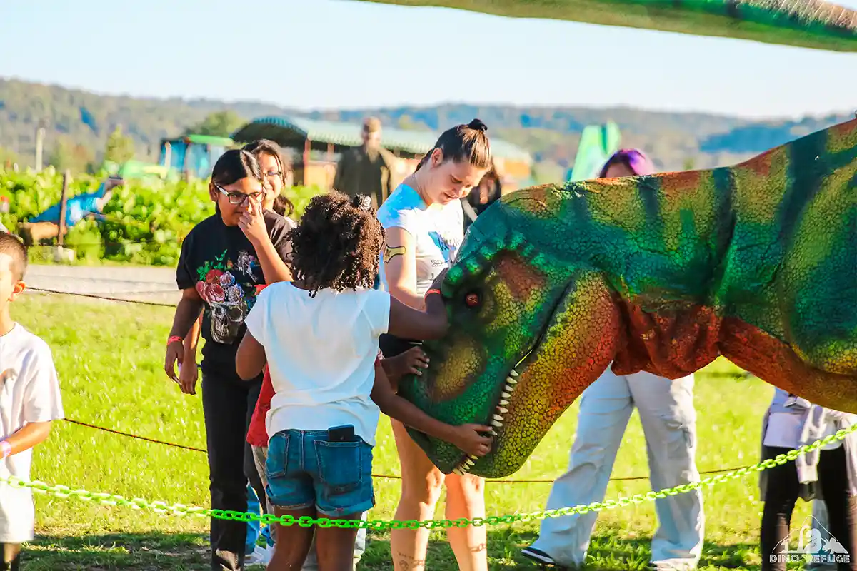 people petting t-rex figure