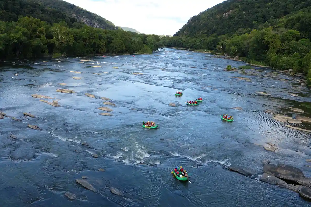 people tubing down river near harpers ferry