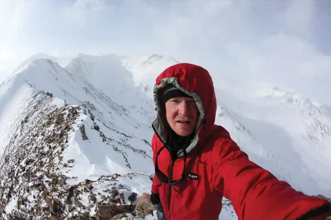 sean burch on top of snow covered mountain