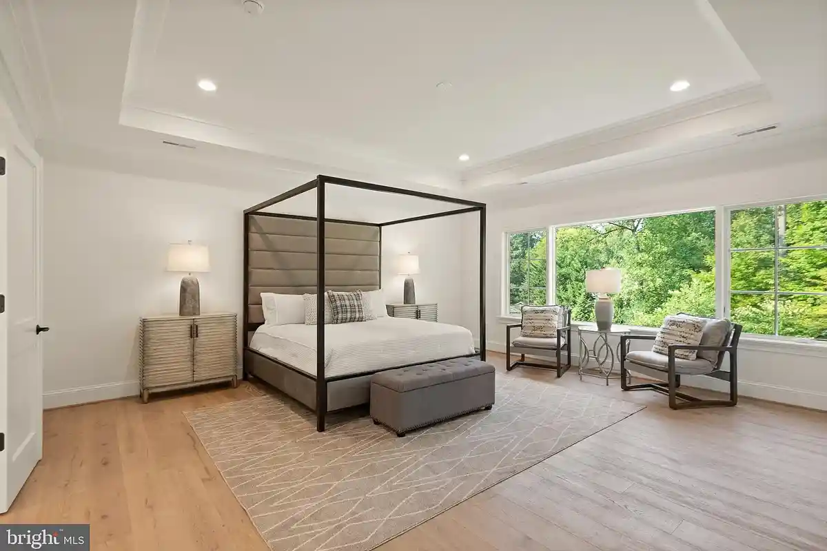 primary bedroom with wall of windows