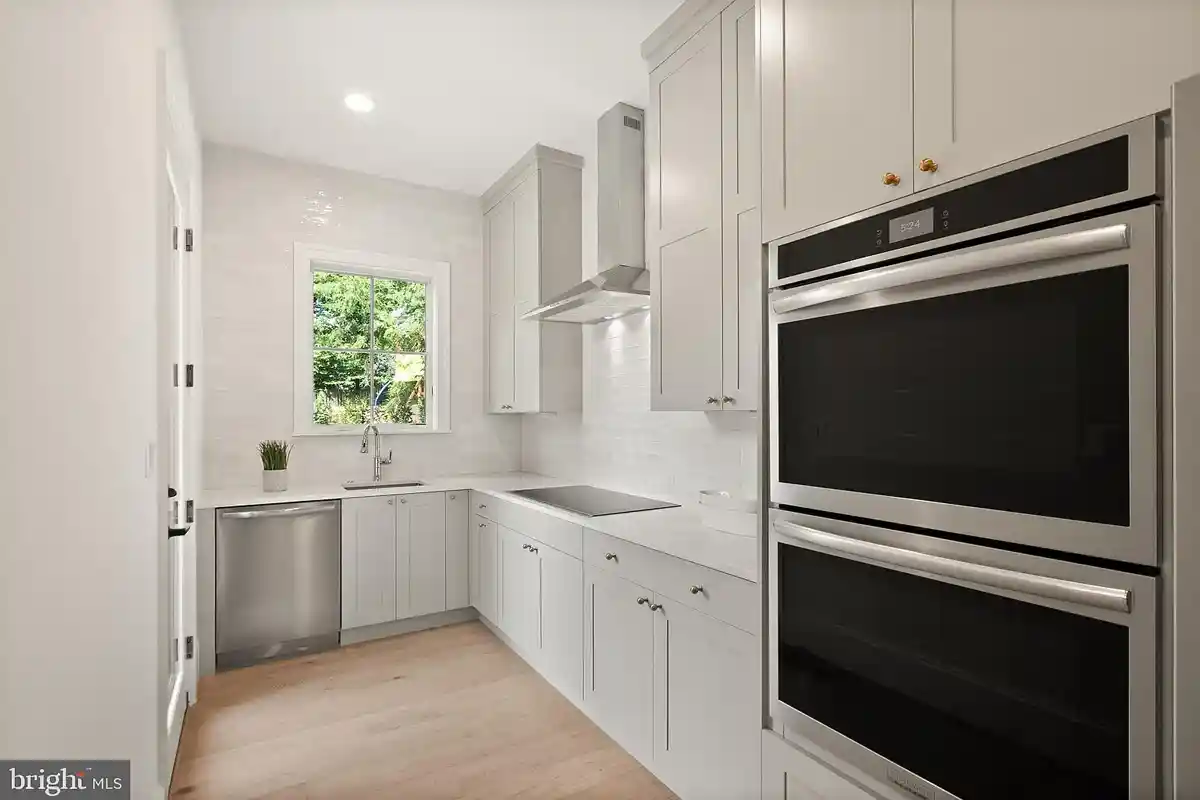 prep kitchen with oven and dishwasher