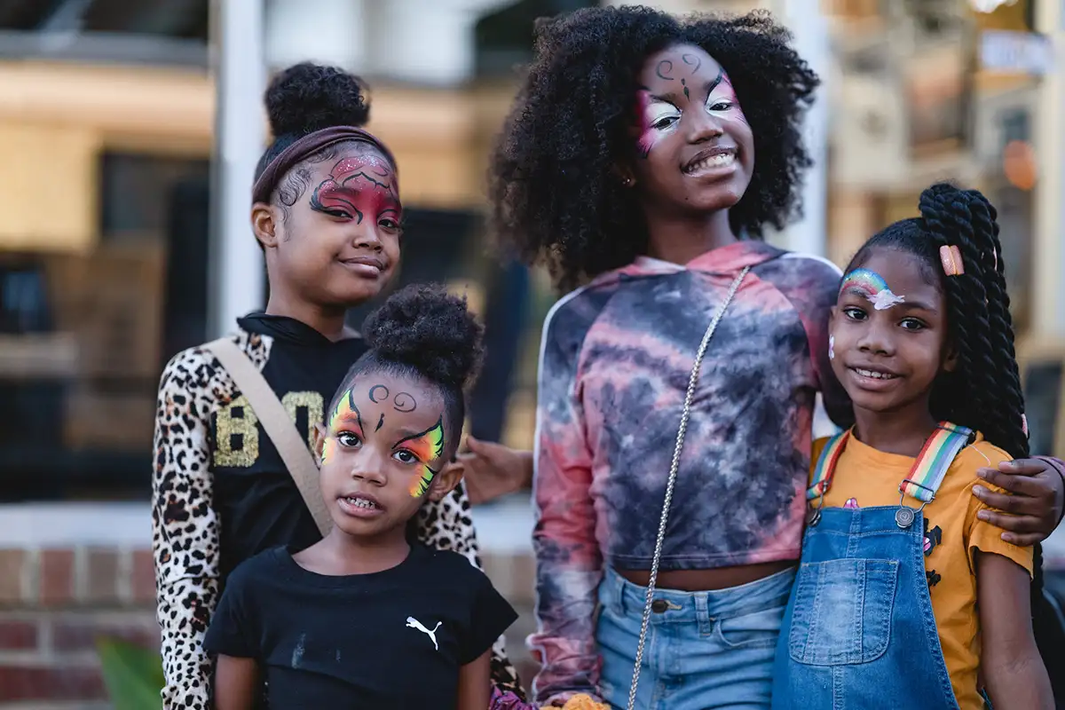 Kids with face paint at Art All Night
