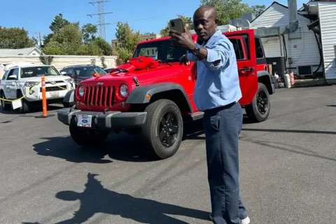 Francis Apraku receiving his Jeep