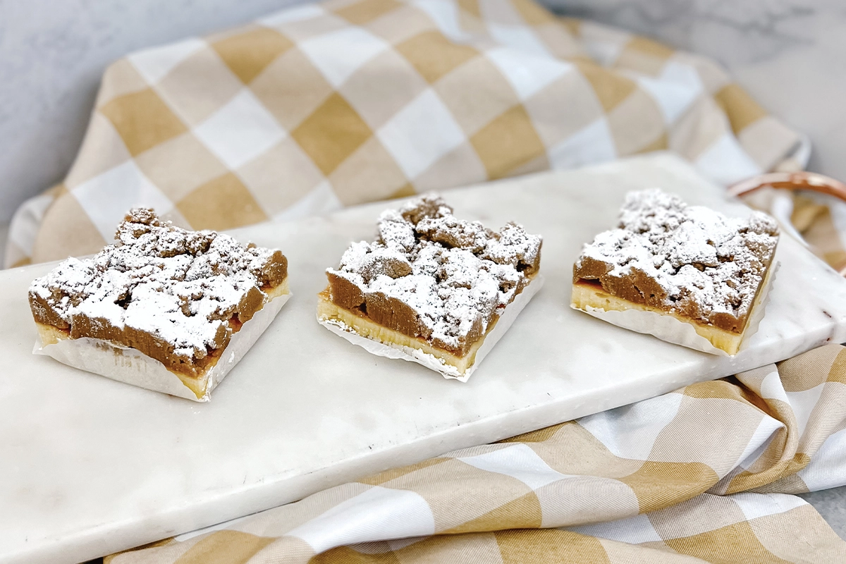 cinnamon crumb cake covered in powdered sugar
