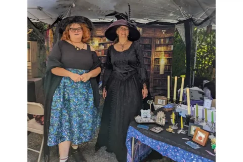 two women dressed as witches at diagon alley market