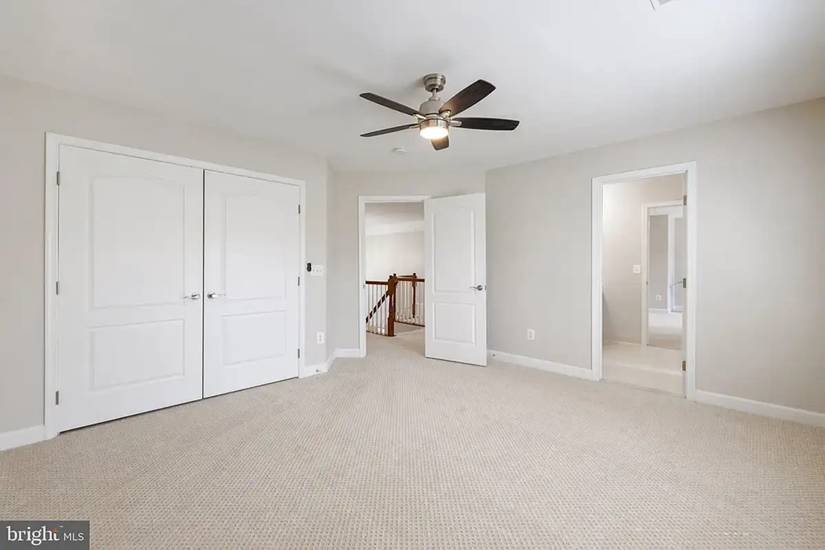 Empty bedroom with closet,