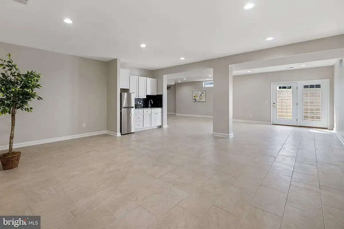Mini kitchen and empty lower level.