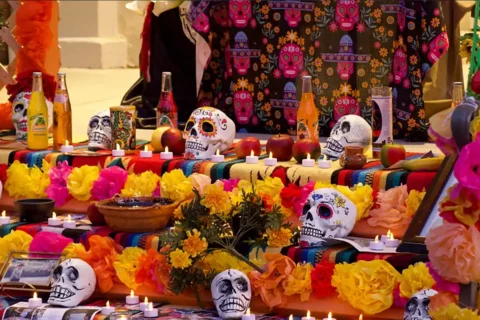 sugar skulls on ofrenda for dia de los muertos