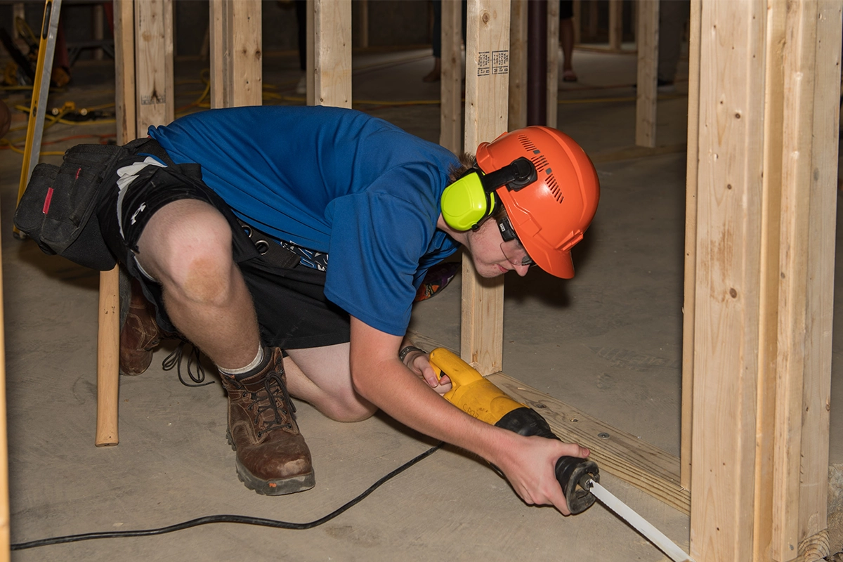 Student working on a Spring Village Estates home