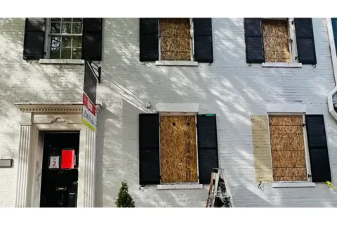Boarded up Little Birdie's in Alexandria