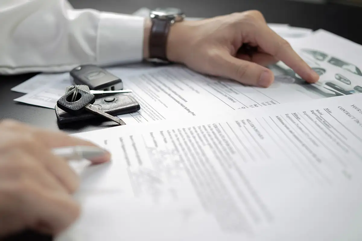 Signing contract at car dealershio