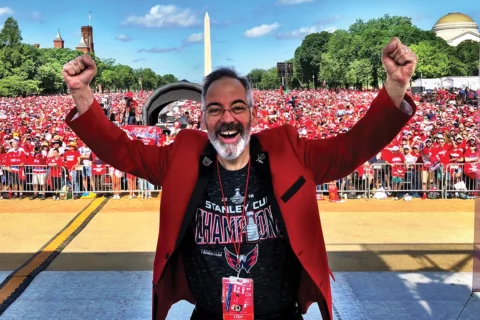 Wes Johnson cheering with crowd on National Mall