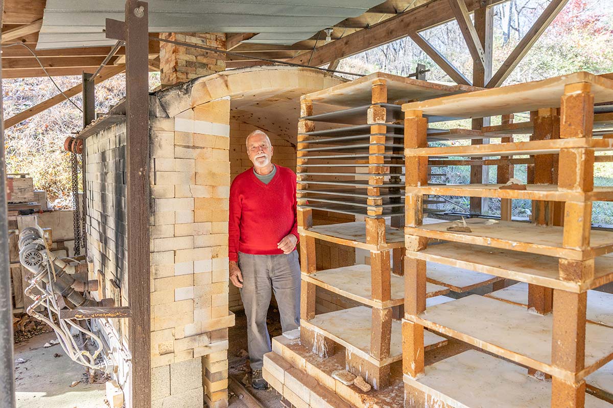 Norton standing in his self-built kiln