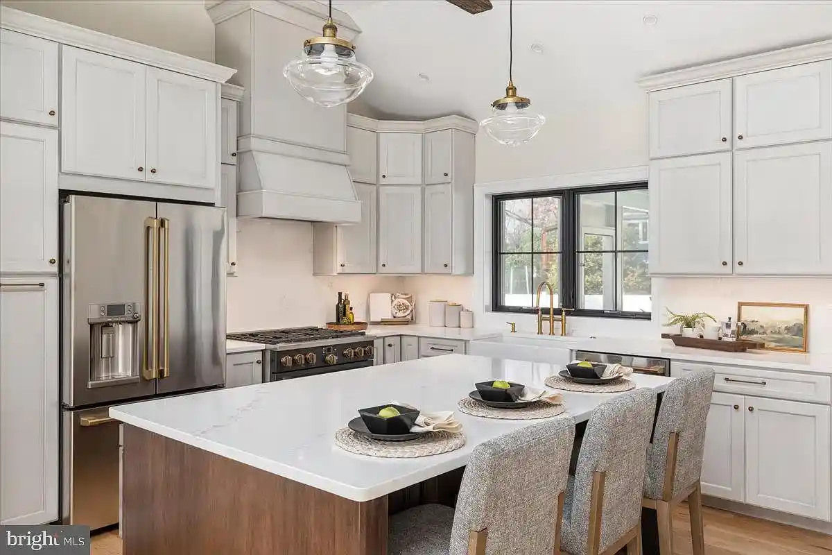 open kitchen with island and white cabinets