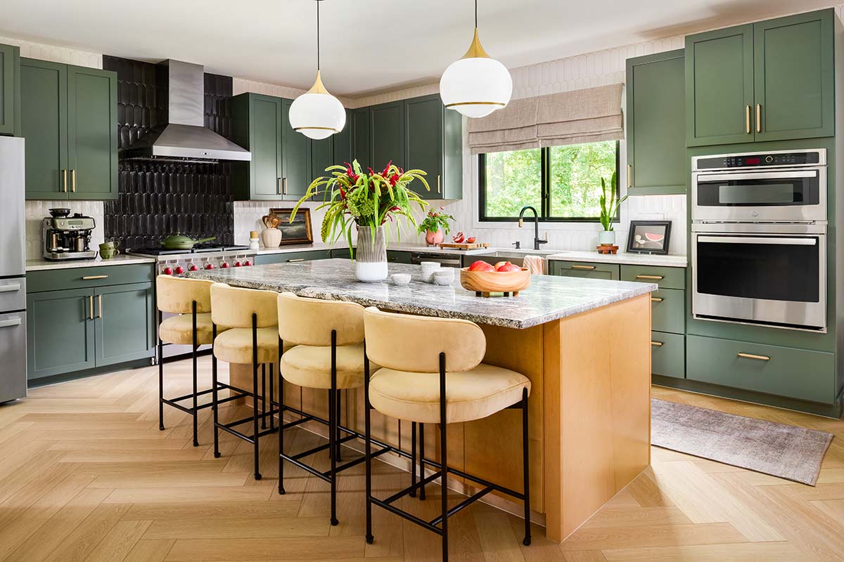 kitchen with green cabinets and custom island