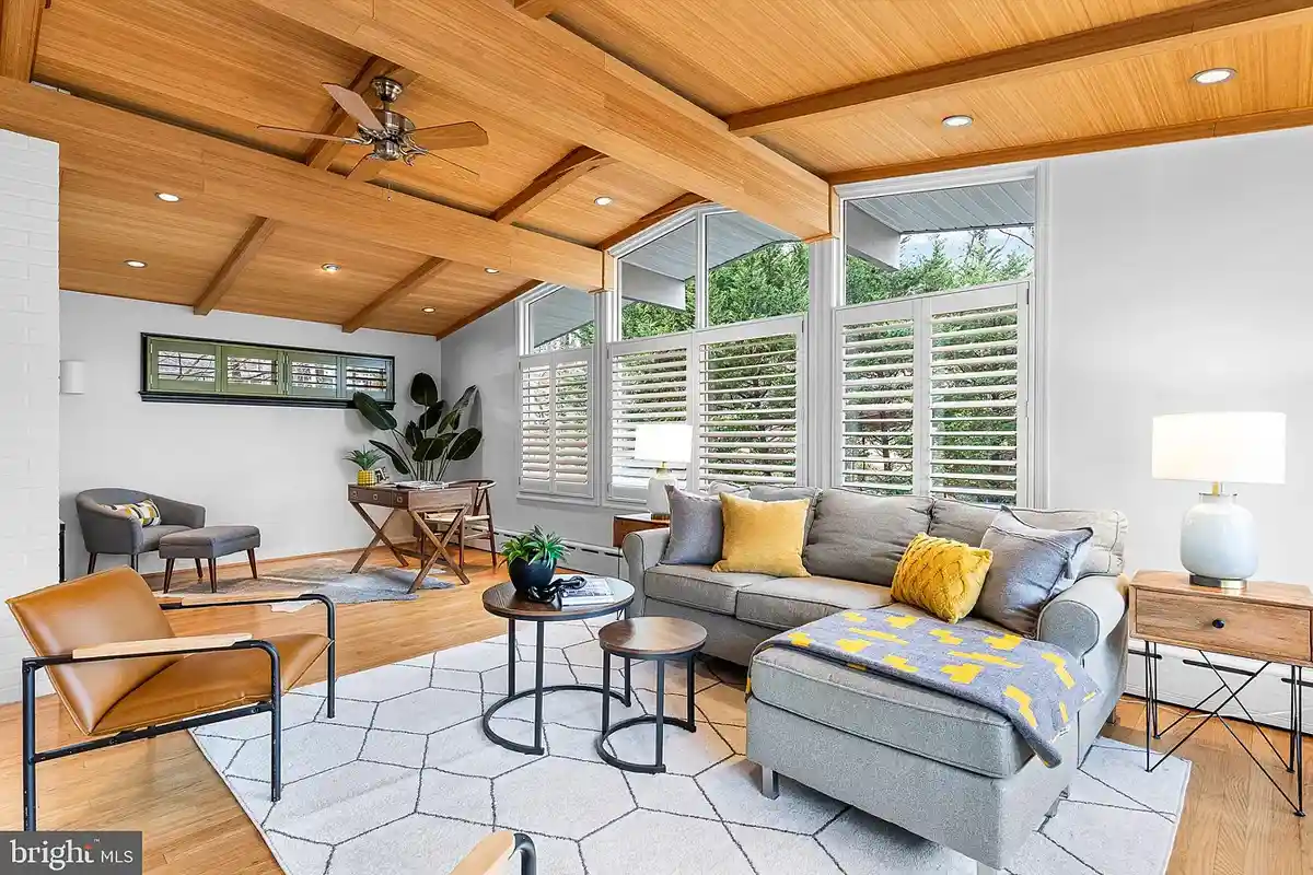 family room with wood vaulted ceilings and wood floors