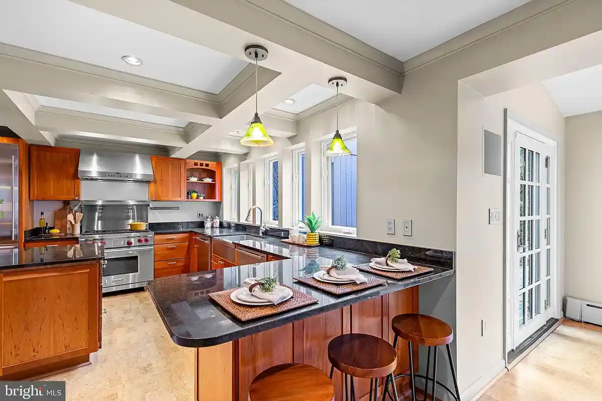 chef's kitchen with granite counters and island
