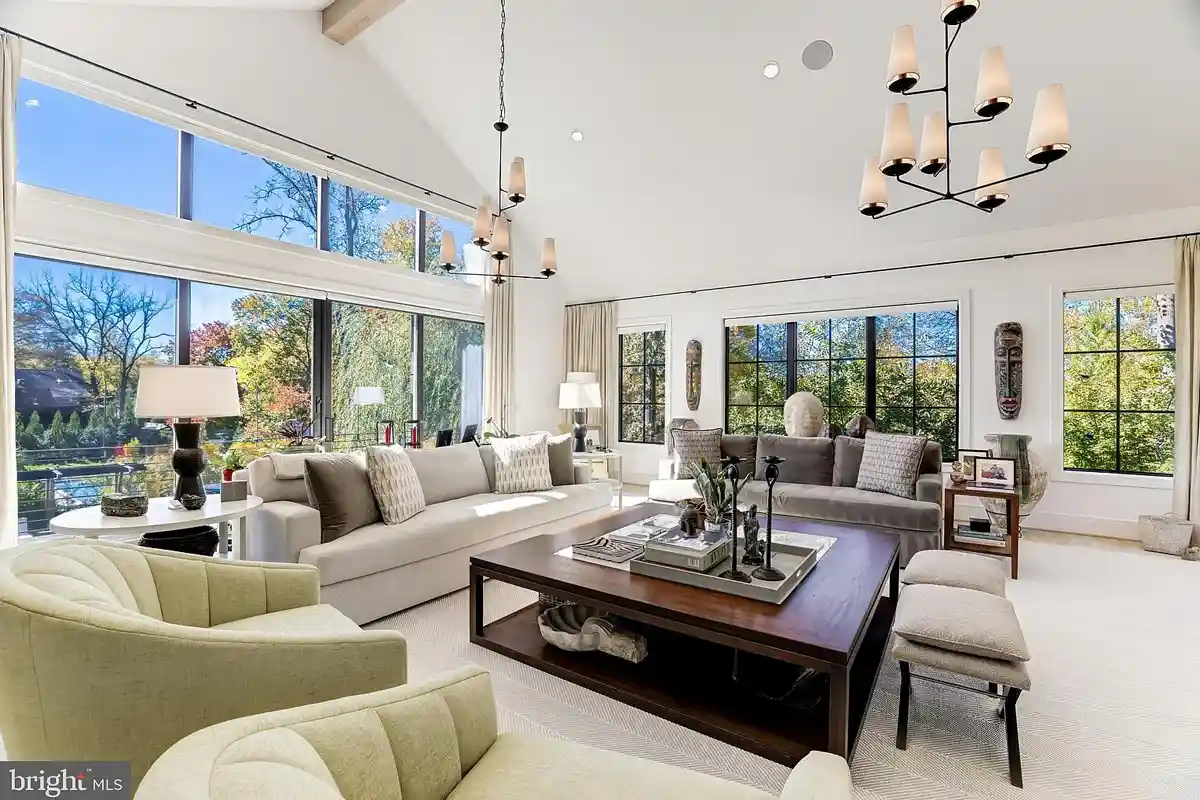 great room with multiple couches and chairs, view of backyard