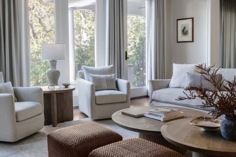 living room with sofa and chairs