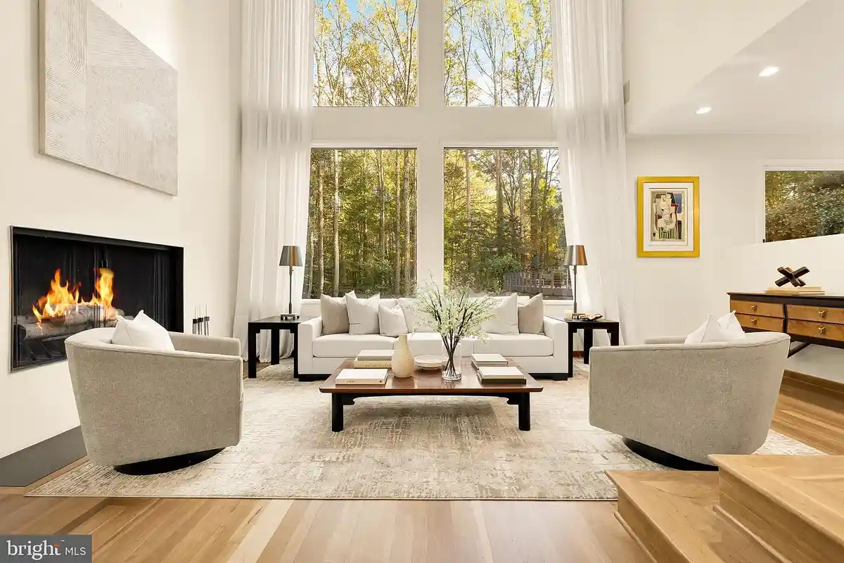 family room with fireplace and floor-to-ceiling windows