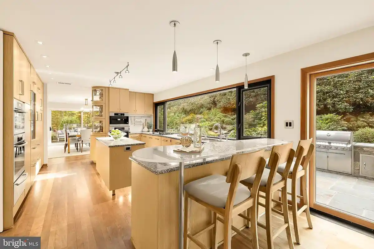 kitchen with granite countertops and floating glass peninsula