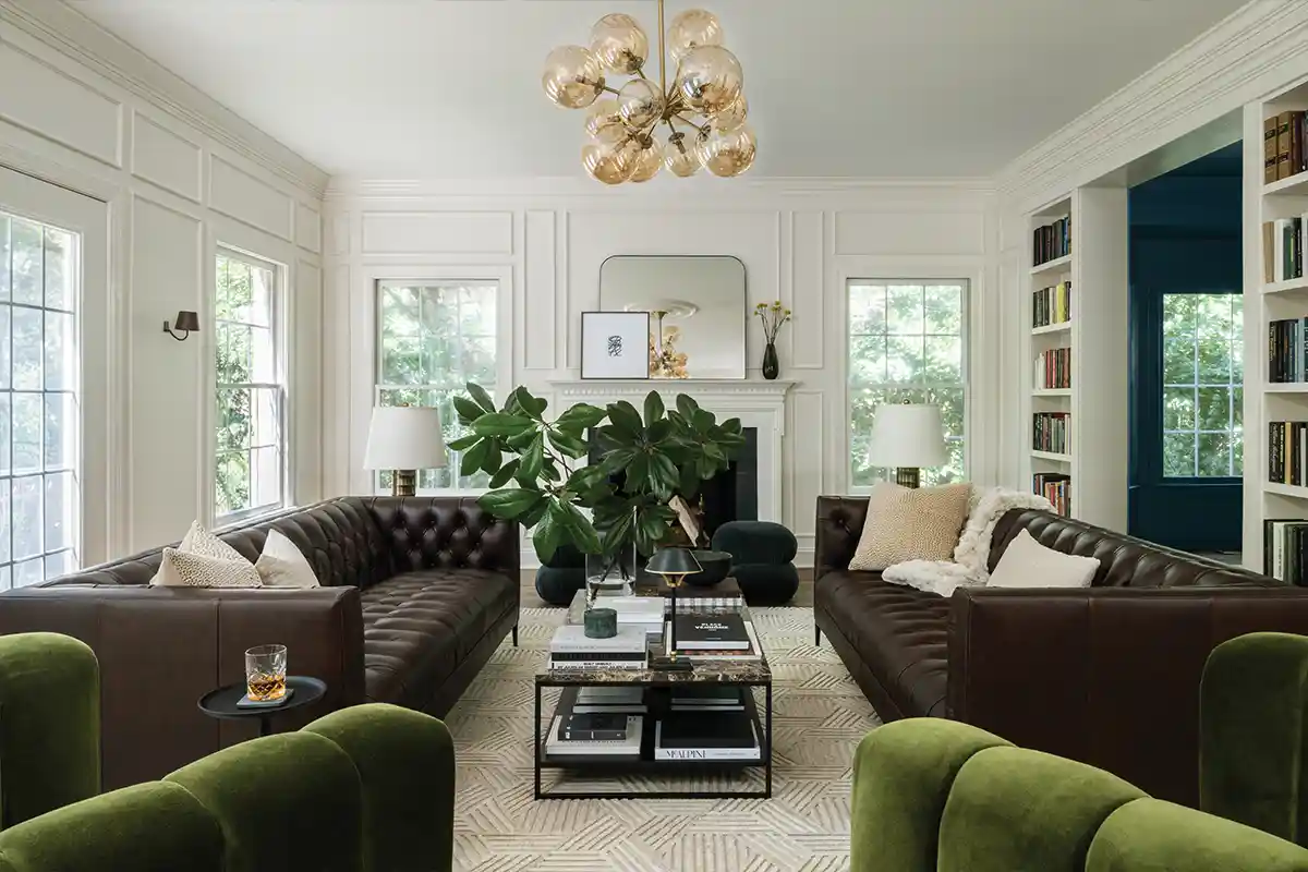 living room with leather couches and green accents