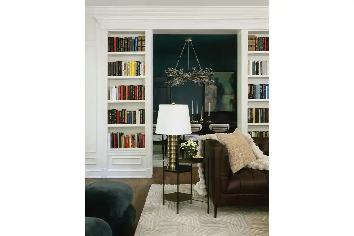 bookcases surround the doorway leading to the dining room
