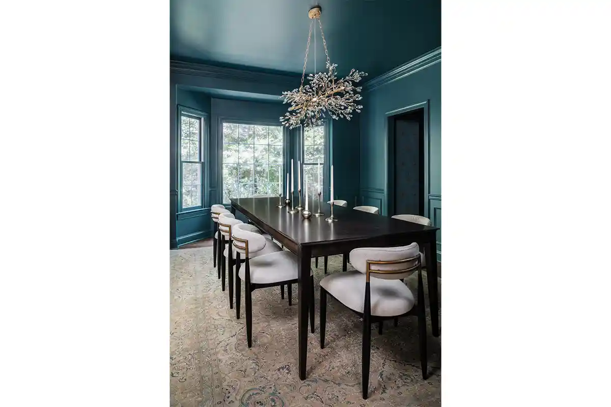 teal dining room with chandelier 