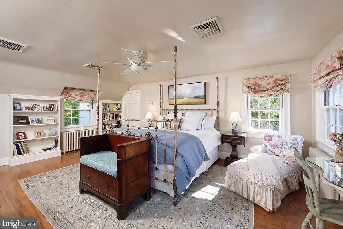 primary bedroom with bed and additional seating